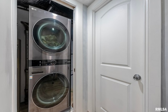 laundry area featuring stacked washer / drying machine