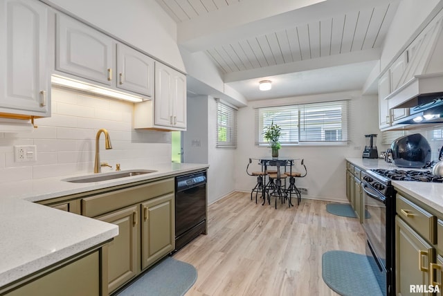 kitchen with white cabinetry, sink, lofted ceiling with beams, light hardwood / wood-style floors, and black appliances