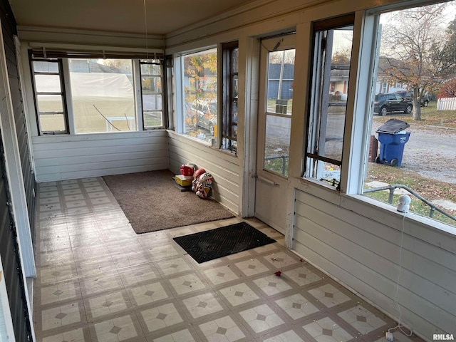 unfurnished sunroom featuring a wealth of natural light