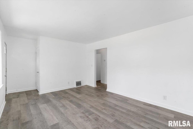 spare room featuring light hardwood / wood-style floors