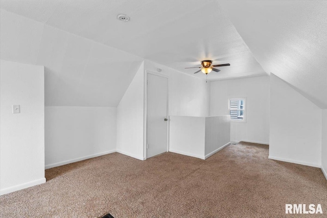 bonus room with carpet flooring, a textured ceiling, ceiling fan, and lofted ceiling