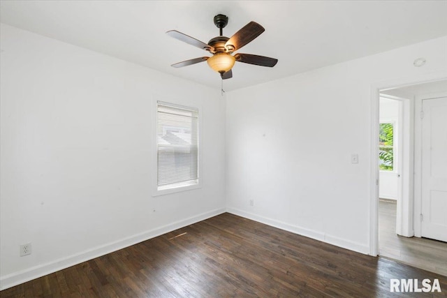 empty room featuring dark hardwood / wood-style floors and plenty of natural light