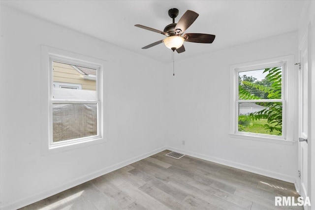 unfurnished room featuring ceiling fan and light hardwood / wood-style flooring