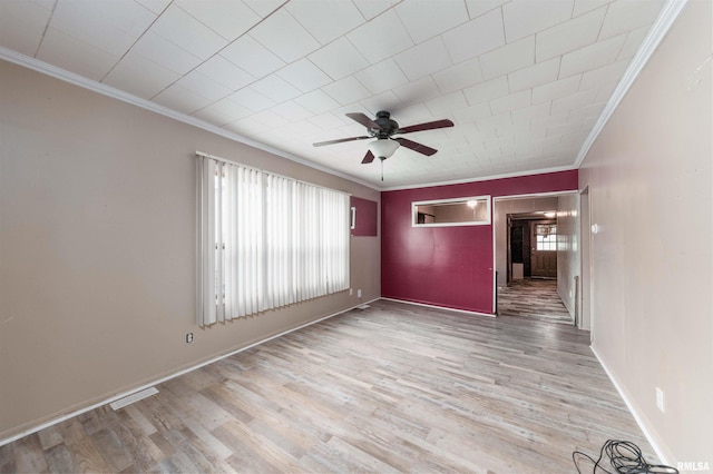 unfurnished room with ceiling fan, light hardwood / wood-style flooring, and ornamental molding