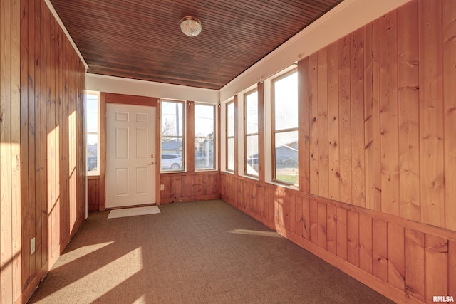 unfurnished sunroom featuring wood ceiling