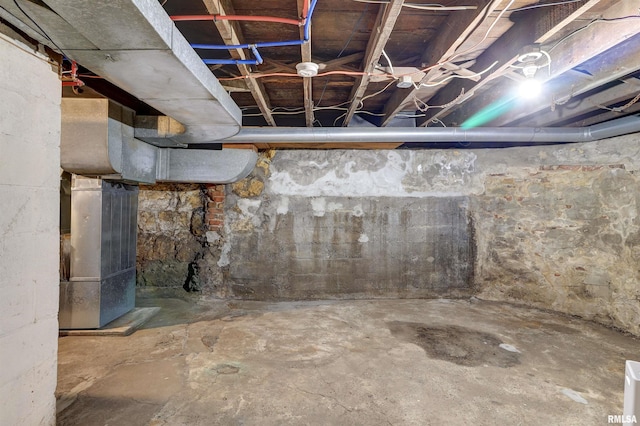 basement featuring heating unit