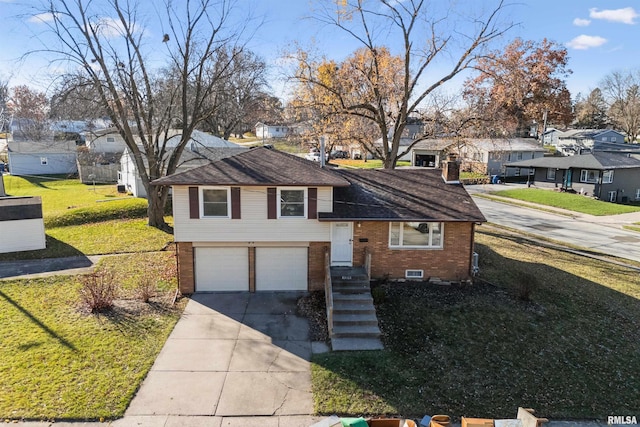 tri-level home featuring a garage and a front lawn