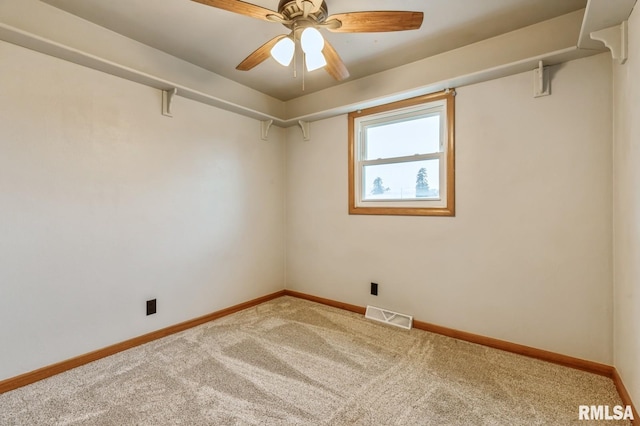 empty room with carpet flooring and ceiling fan