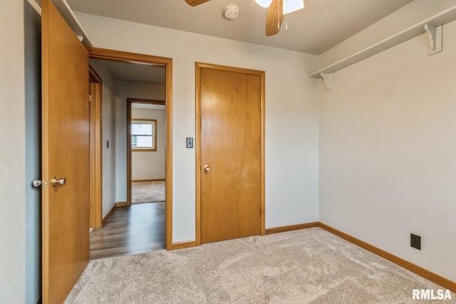 spare room with ceiling fan and dark hardwood / wood-style floors