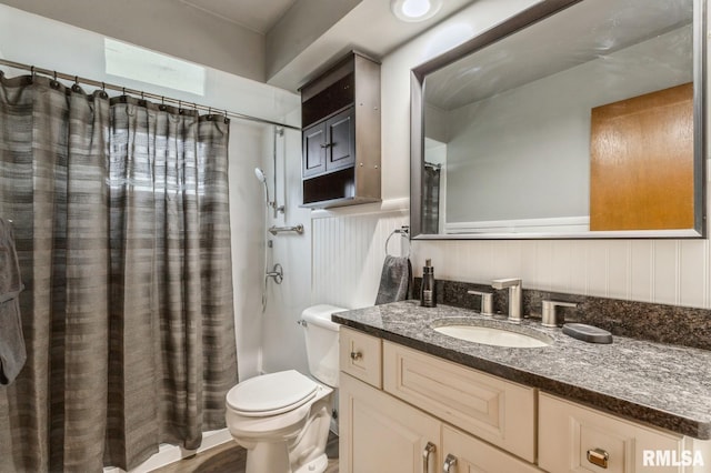 bathroom with vanity, wood-type flooring, and toilet