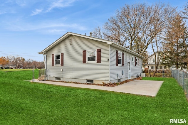 view of home's exterior with a patio area and a yard