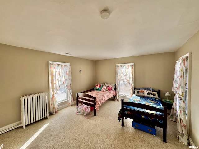 bedroom featuring carpet flooring and radiator