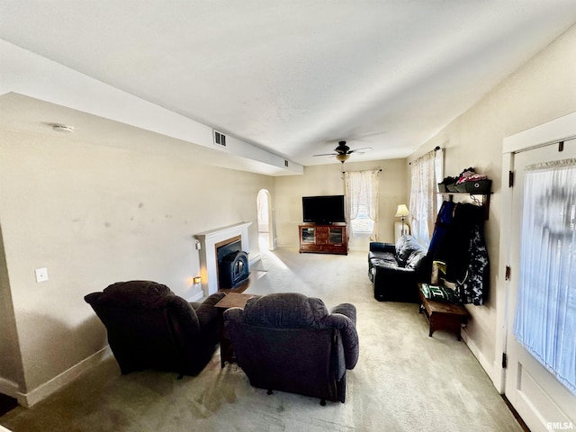 living room with carpet and ceiling fan