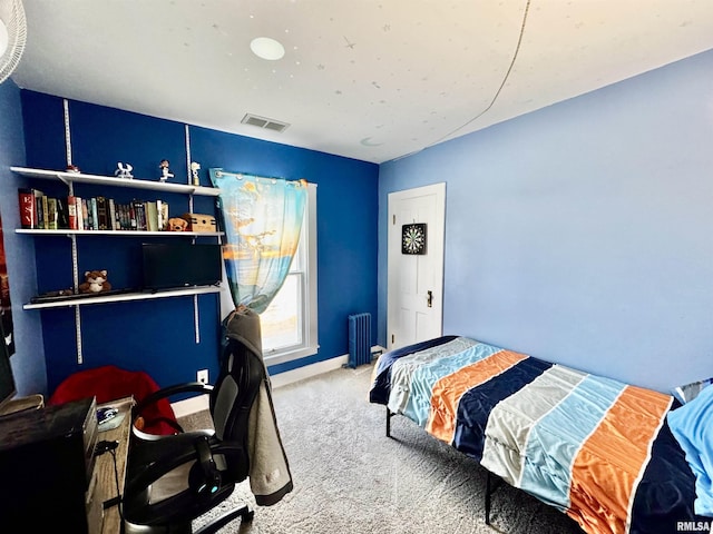 bedroom featuring carpet flooring and radiator heating unit