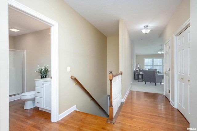 hall with light hardwood / wood-style flooring