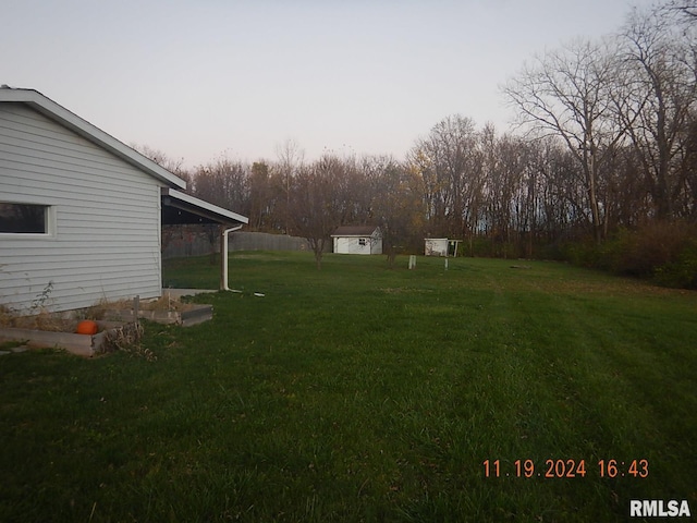 yard at dusk with a shed