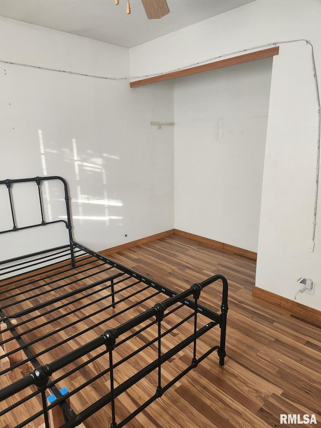 unfurnished bedroom with dark hardwood / wood-style floors