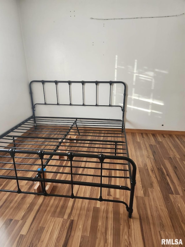 bedroom featuring hardwood / wood-style flooring