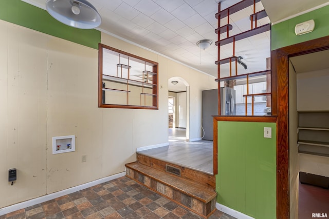 interior space with crown molding and washer hookup