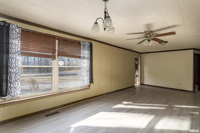 unfurnished room featuring ornamental molding, ceiling fan, and dark hardwood / wood-style flooring