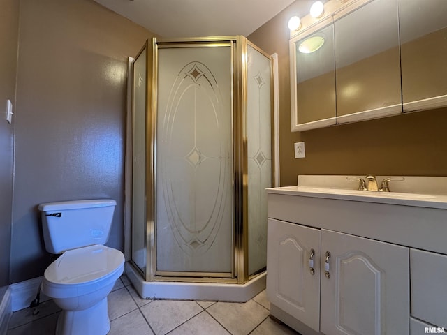 bathroom featuring vanity, tile patterned floors, toilet, and a shower stall