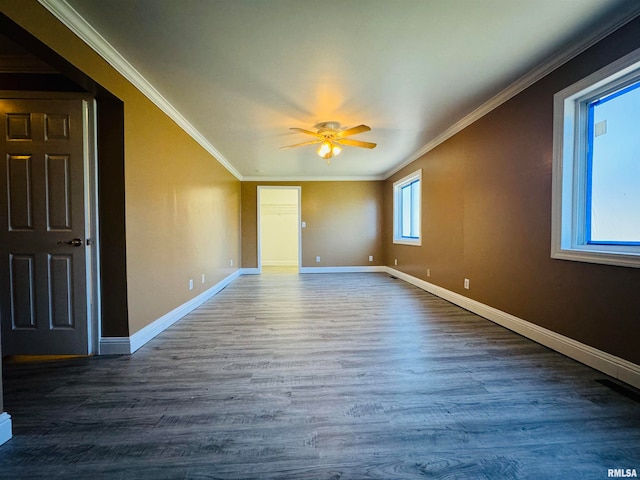 spare room featuring ceiling fan, wood-type flooring, and ornamental molding