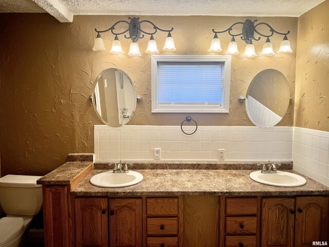 spare room featuring ornamental molding, a ceiling fan, baseboards, and wood finished floors