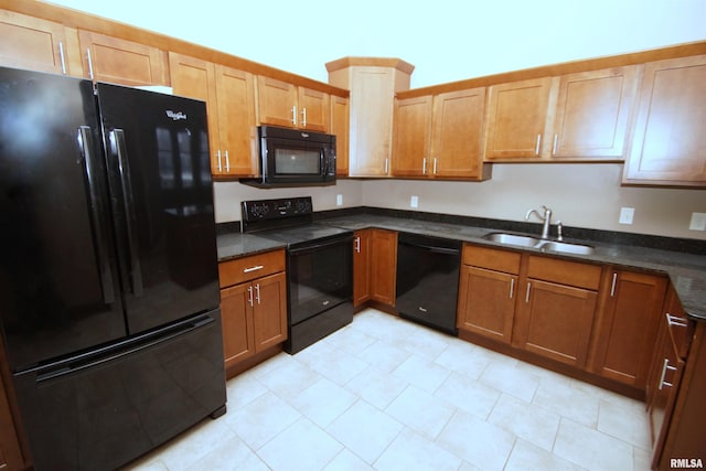 kitchen featuring sink and black appliances