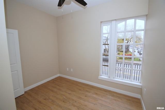 spare room featuring ceiling fan and light hardwood / wood-style floors