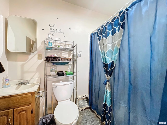 bathroom with a shower with curtain, vanity, and toilet