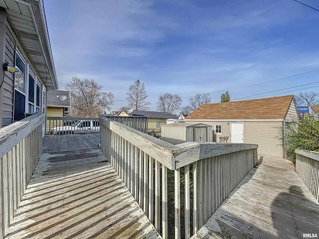 wooden terrace with a shed