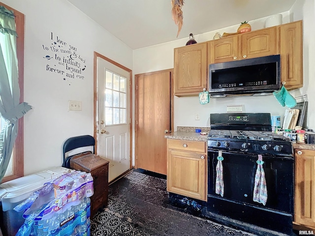 kitchen featuring black gas range