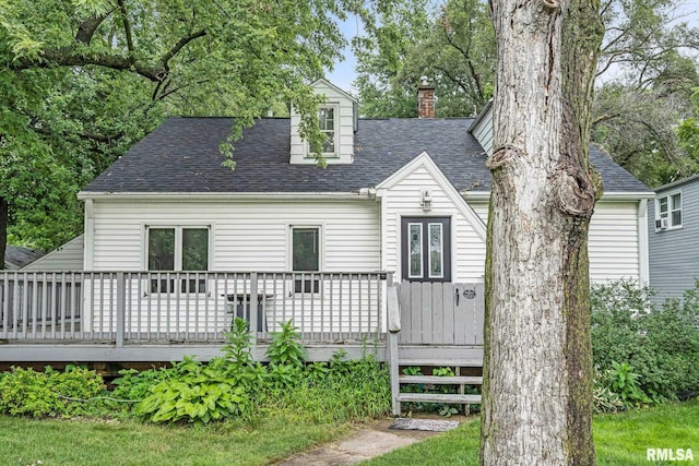 back of house featuring a wooden deck