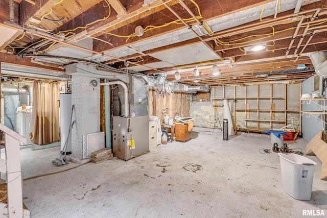 basement with gas water heater, washer / clothes dryer, and heating unit