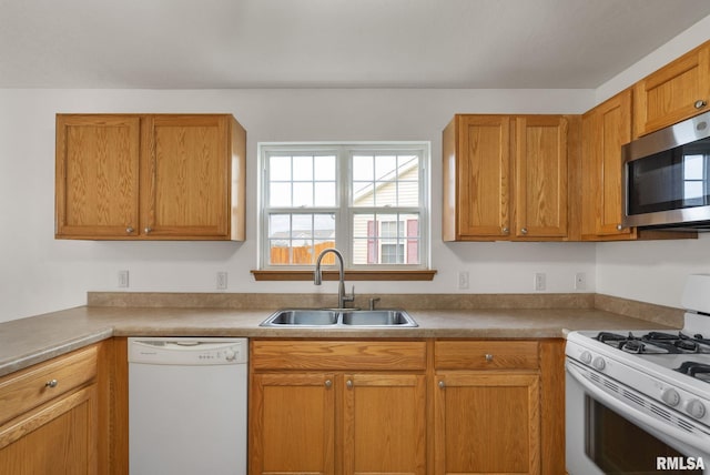 kitchen with white appliances and sink