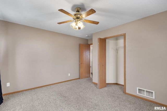 unfurnished bedroom with light carpet, a closet, and ceiling fan