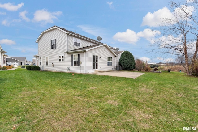 back of house featuring a yard, a patio, and central AC unit