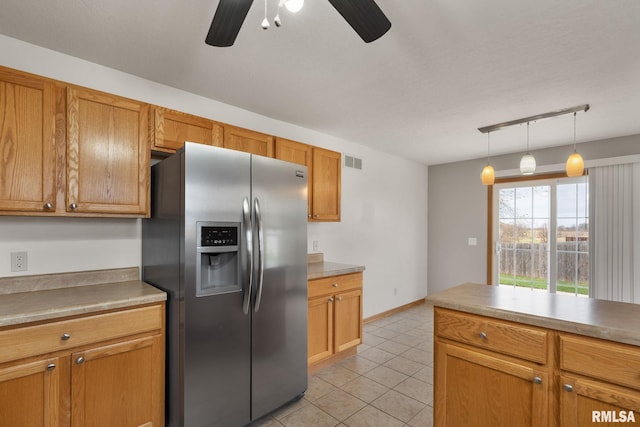 kitchen with rail lighting, stainless steel refrigerator with ice dispenser, ceiling fan, light tile patterned floors, and decorative light fixtures