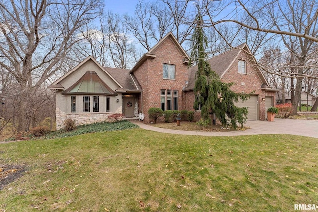 view of front of home with a front yard and a garage