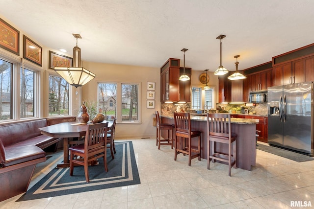 dining room featuring light tile patterned floors