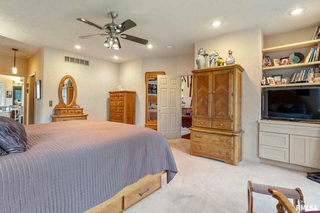 bedroom featuring ceiling fan and light carpet