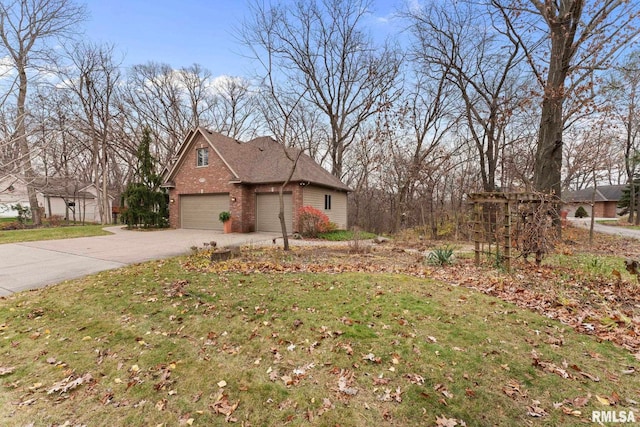 exterior space with a yard and a garage