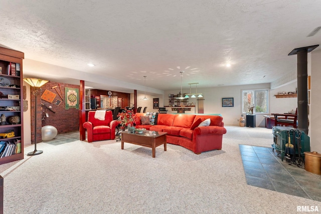 carpeted living room with a textured ceiling