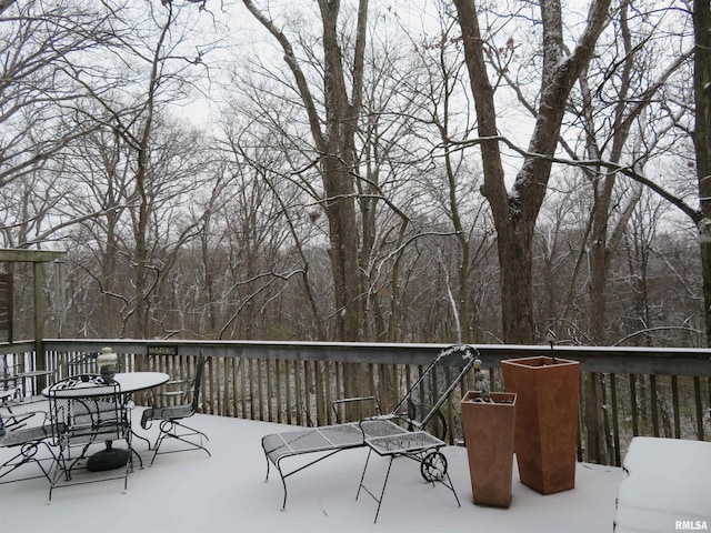 view of snow covered deck