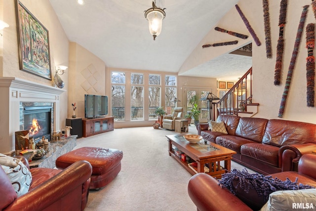 carpeted living room featuring lofted ceiling and a premium fireplace