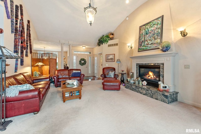 carpeted living room featuring a fireplace