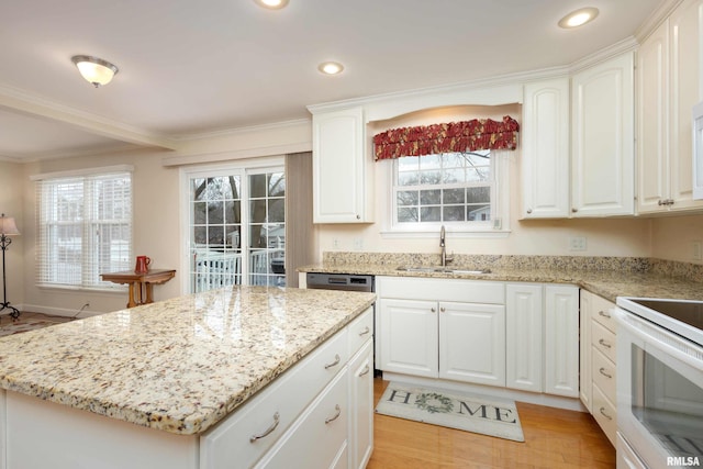 kitchen with white cabinets, light hardwood / wood-style flooring, and plenty of natural light