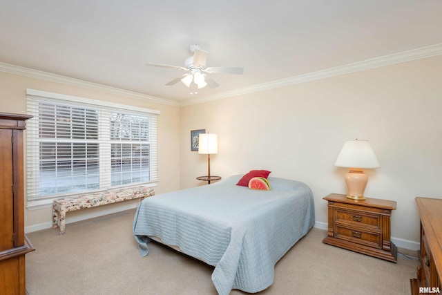 bedroom with ceiling fan, light colored carpet, and crown molding