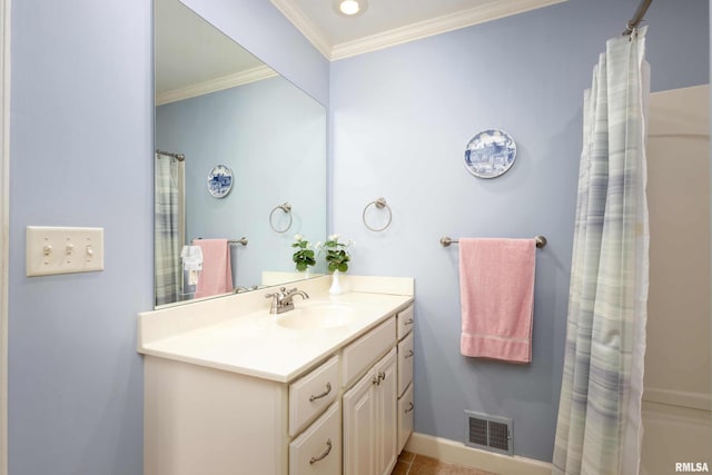 bathroom featuring tile patterned flooring, vanity, and ornamental molding