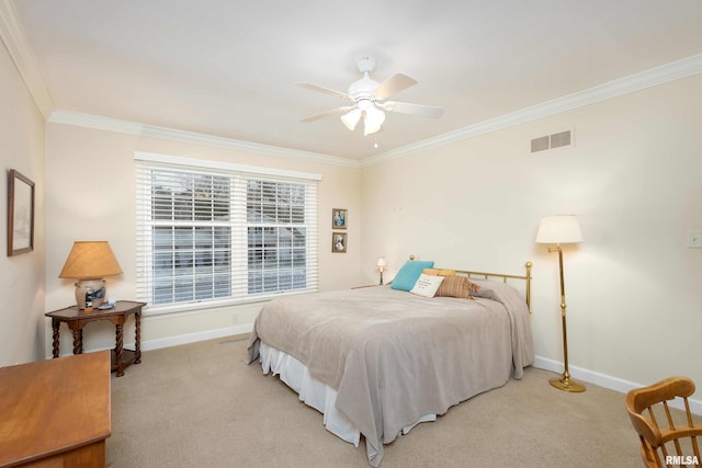 bedroom with ceiling fan, ornamental molding, and light carpet